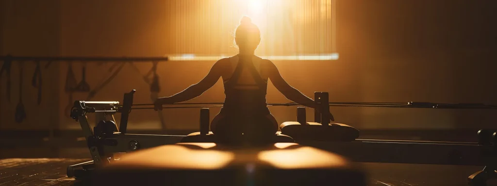 a person performing pilates reformer exercises on a reformer pilates machine.