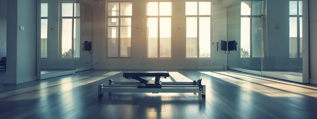 a sleek, modern pilates reformer machine surrounded by mirrors, natural light filtering through large windows, creating an inviting and professional studio setting.